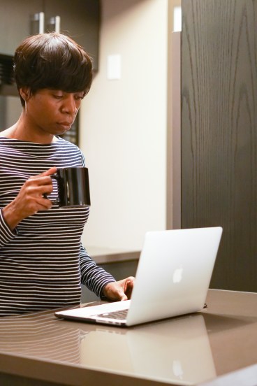 womanonlaptopinkitchen