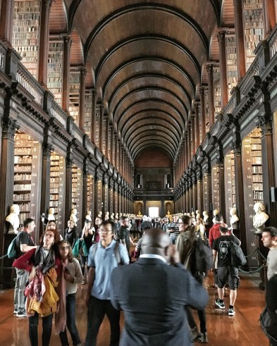 Inside of the Trinity College Library in Dublin, with rows of old books
