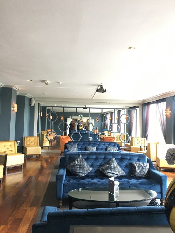Sandymount Hotel seating lounge area with blue and yellow chairs