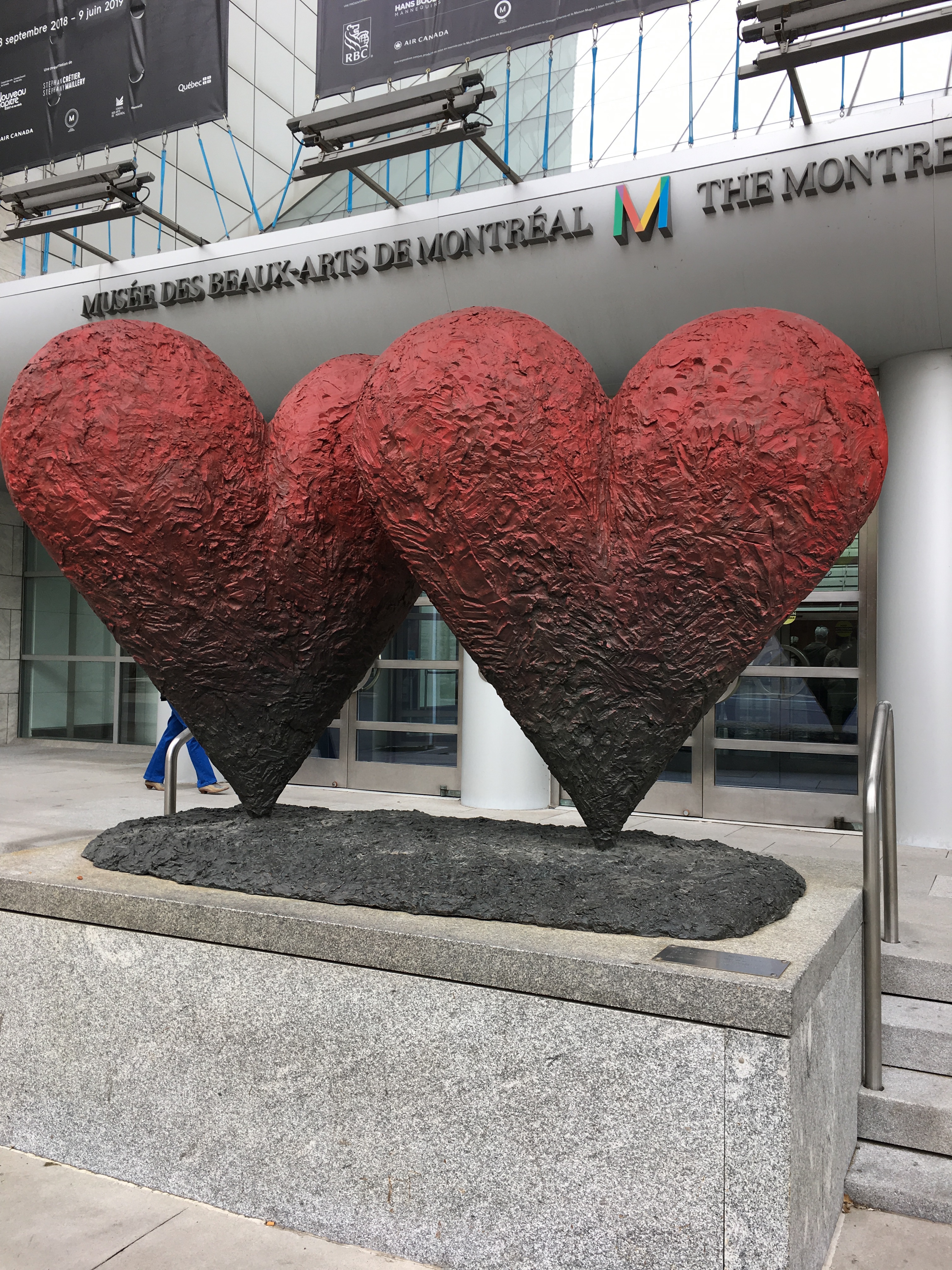 Two large red heart statutes in front of the Museum of Fine Arts
