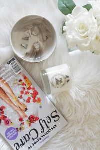 Flatlay of Selfcare magazine and candle
